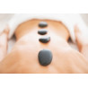 Massage aux pierres chaudes, relaxation intense et bien-être profond, dans notre espace bien-être au cœur du Nord de la France